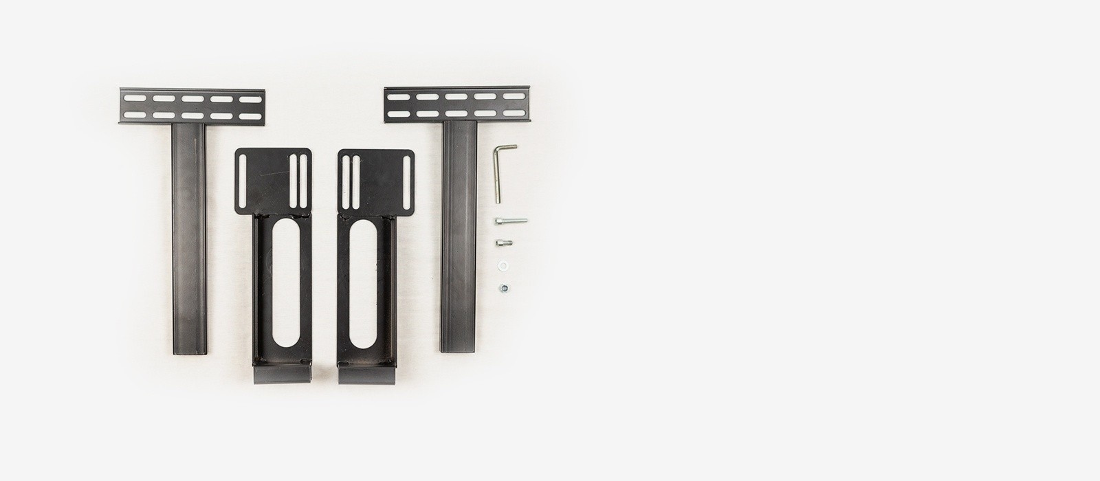 The components of a universal head board bracket kit, including 4 brackets, an assortment of bolt and wshers and an allen wrench tool